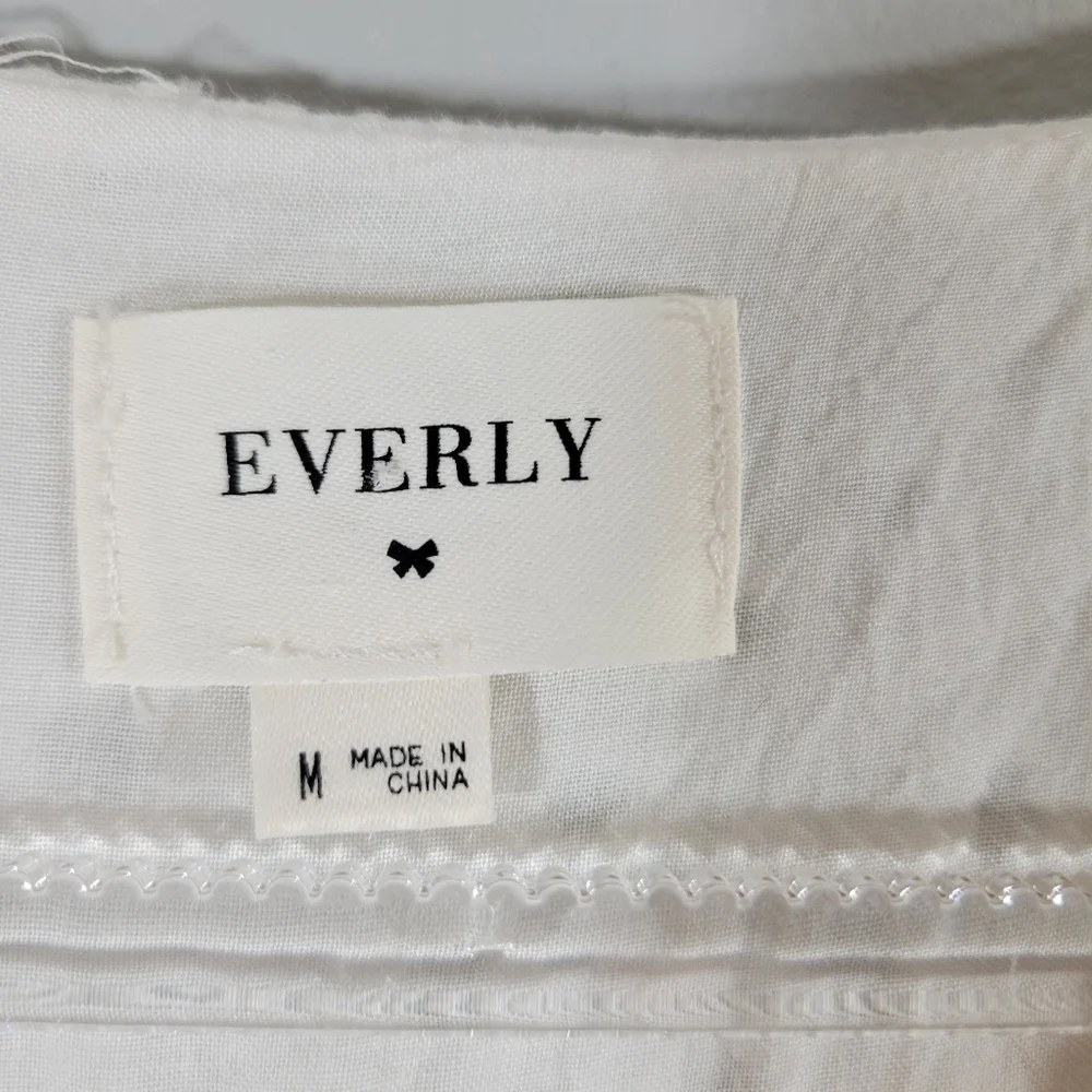 EVERLY white eyelet surplice faux wrap belted cotton ruffle hem romper